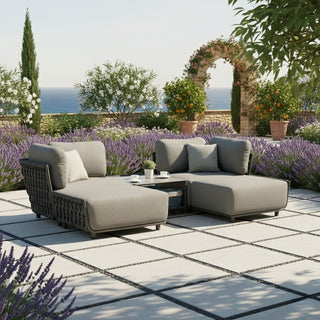 Outdoor patio with a sectional sofa, coffee table, and lavender plants.