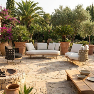 Outdoor patio with wicker furniture, potted plants, and a fire pit.