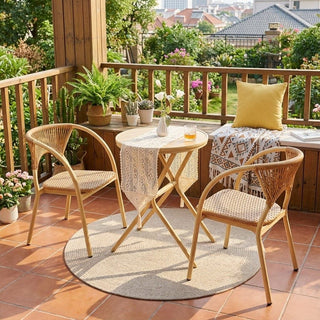 Outdoor patio with wooden table and chairs, plants, and a yellow cushion.