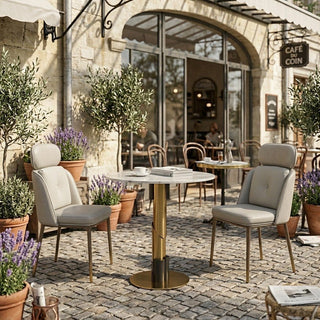 Outdoor seating area with small table cafe and chairs in front of a cafe.