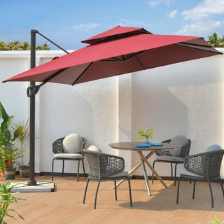 Red patio parasol over a dining table with chairs on a wooden deck.
