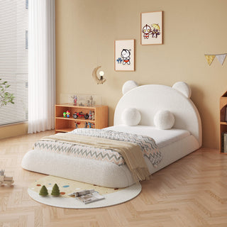 Children's room with a white teddy bear-shaped bed and decorative elements.