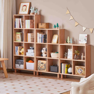 Wooden bookshelf filled with books, toys, and decorative items in a room setting.