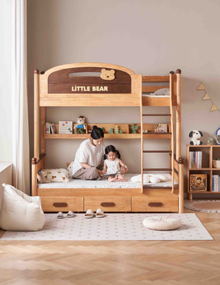 Wooden bunk bed with 'Little Bear' branding in a room with a woman and child.