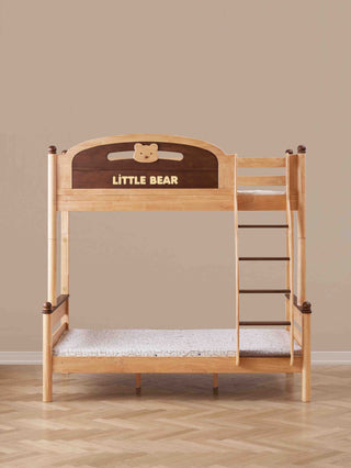Wooden children's bed with 'Little Bear' branding on a beige wall background