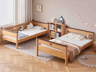 Wooden children's bed with books and toys in a room setting