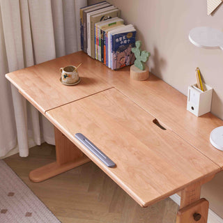 Wooden desk with a bookshelf, cup, and lamp in a home office setting.