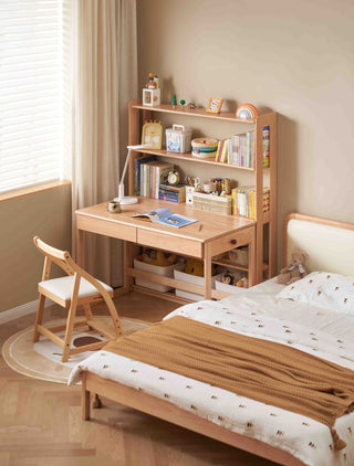 Wooden desk with chair and bookshelf in a bedroom setting