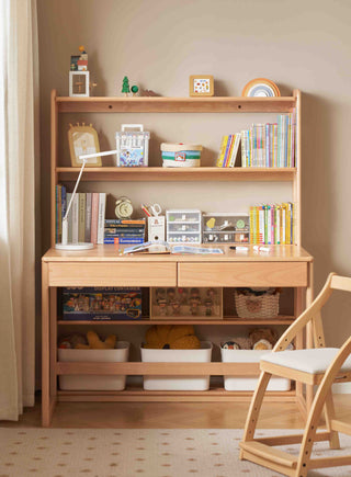 Wooden desk with shelves and books in a room setting