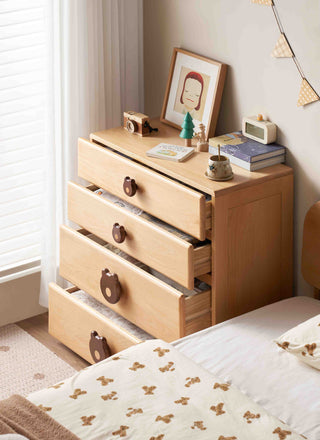 Wooden kids dresser with decorative items in a bedroom setting