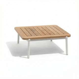 Wooden outdoor table with white legs on a white background
