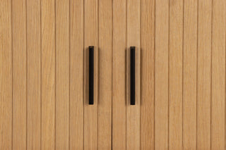 Wooden panel with two black handles on a wooden background