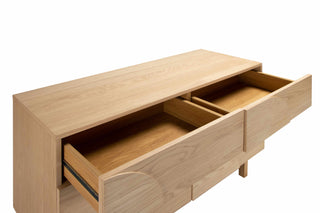 Wooden sideboard with open drawers on a white background
