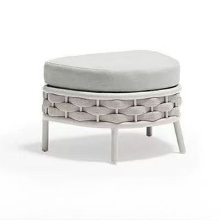 Woven ottoman with a cushion on a white background