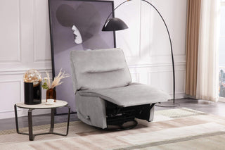 Gray recliner chair in a modern living room setting with a side table and lamp.