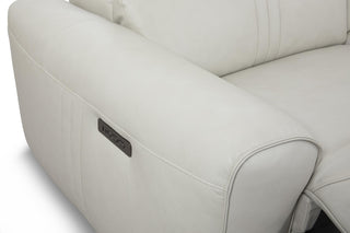 Close-up of a beige sectional sofa on a white background