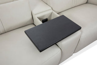 Black tray attached to a beige sectional sofa