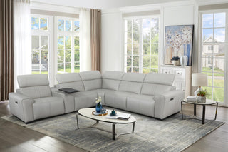 Gray sectional sofa in a living room with a coffee table and decor item in high resolution
