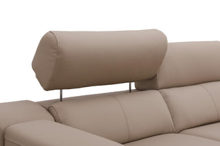Beige recliner sofa with an adjustable headrest on a white background