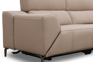 Beige leather sofa with reclining feature on a white background