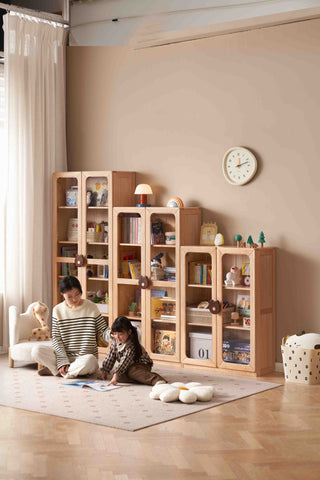 children playing on the floor in a room with wooden childrens bookcase shelf