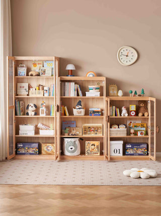 childrens bookcase shelf with various items against a beige wall
