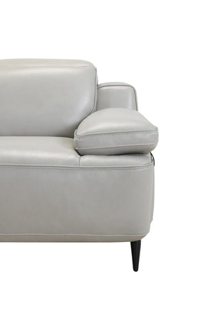 Gray leather sofa with a white background