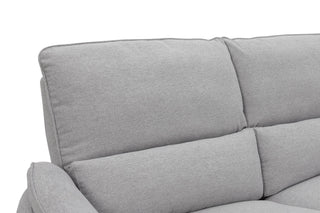Gray sofa with a focus on the cushions on a white background