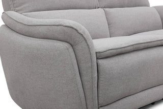 Gray sofa with a focus on the armrest and backrest.