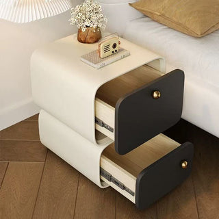 small beside table with open drawer in a bedroom setting