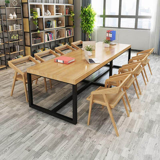 solid wood dining table in conference room setting