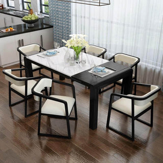 white marble top extendable dining table with dining chairs